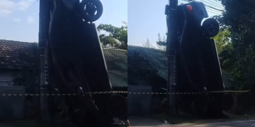 Carro fica em pé após colisão com poste em Guaratiba, na Zona Oeste do Rio